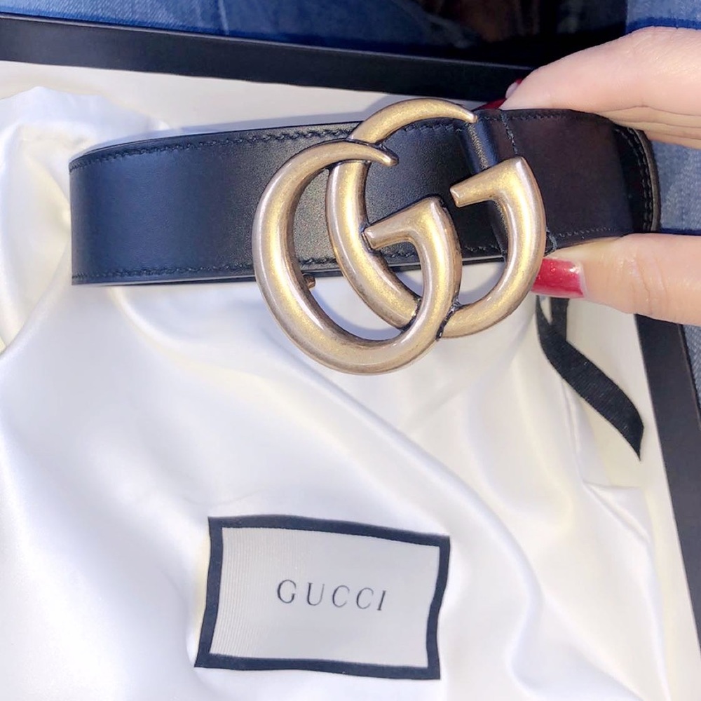 Black and gold Gucci belt